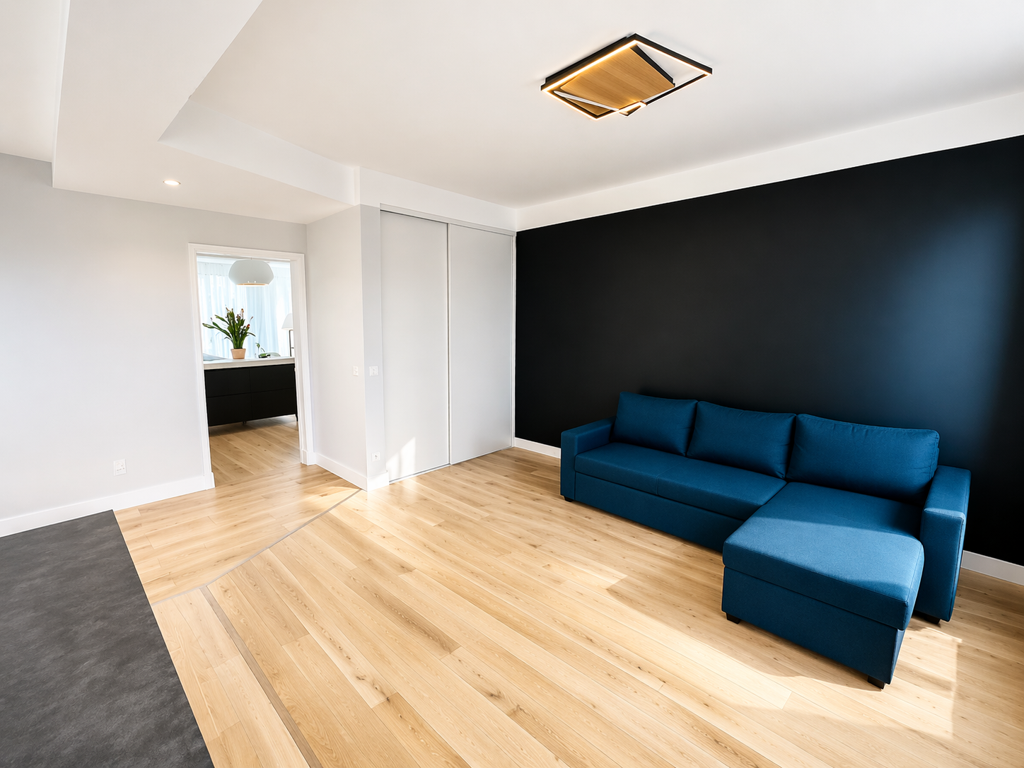 Rénovation salon moderne épuré avec canapé bleu – G&M Bâtiment Paris